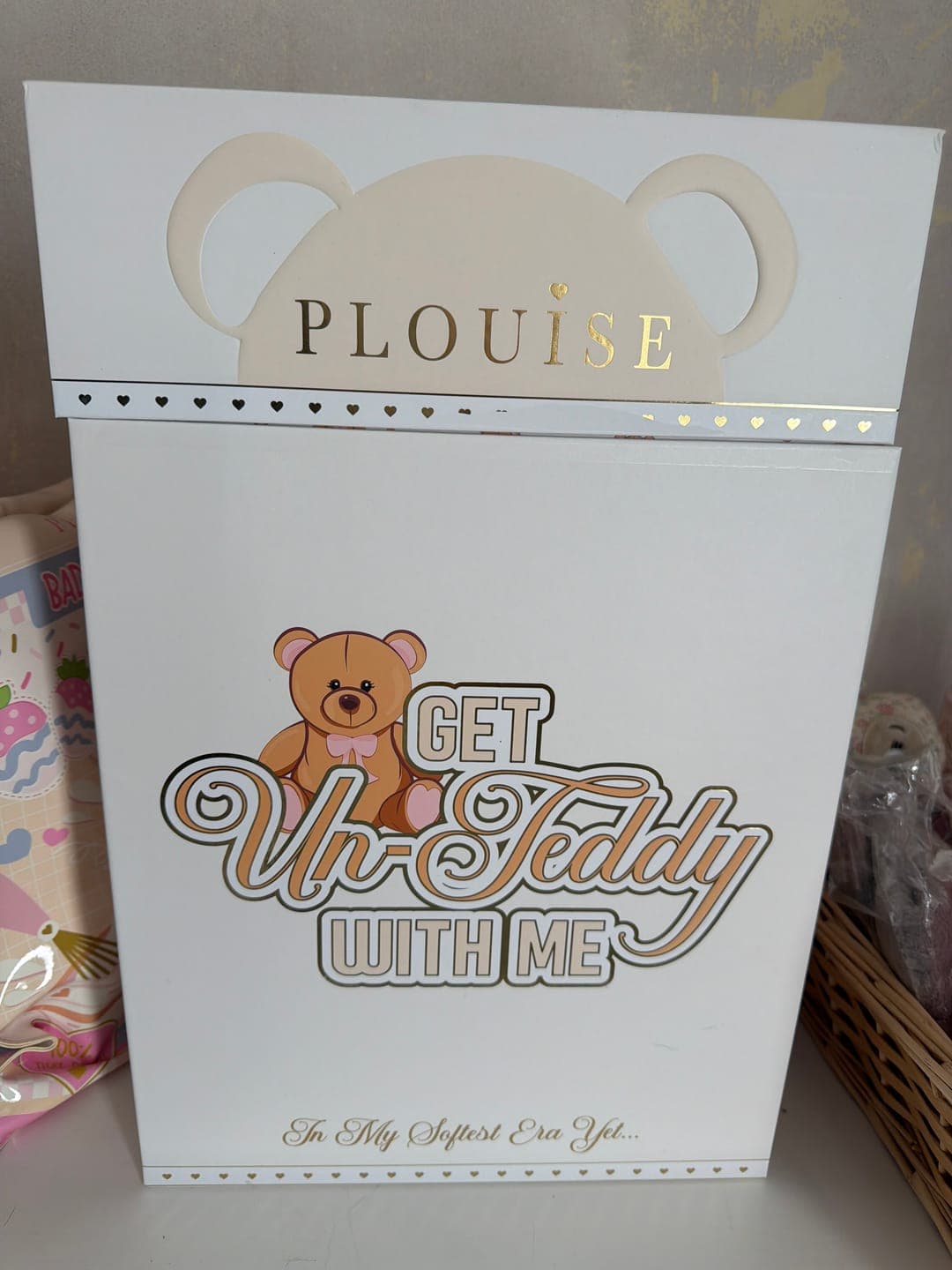 Customer's collectible Get Unteddy With Me PR box, showing the white packaging with a teddy bear graphic and gold lettering.